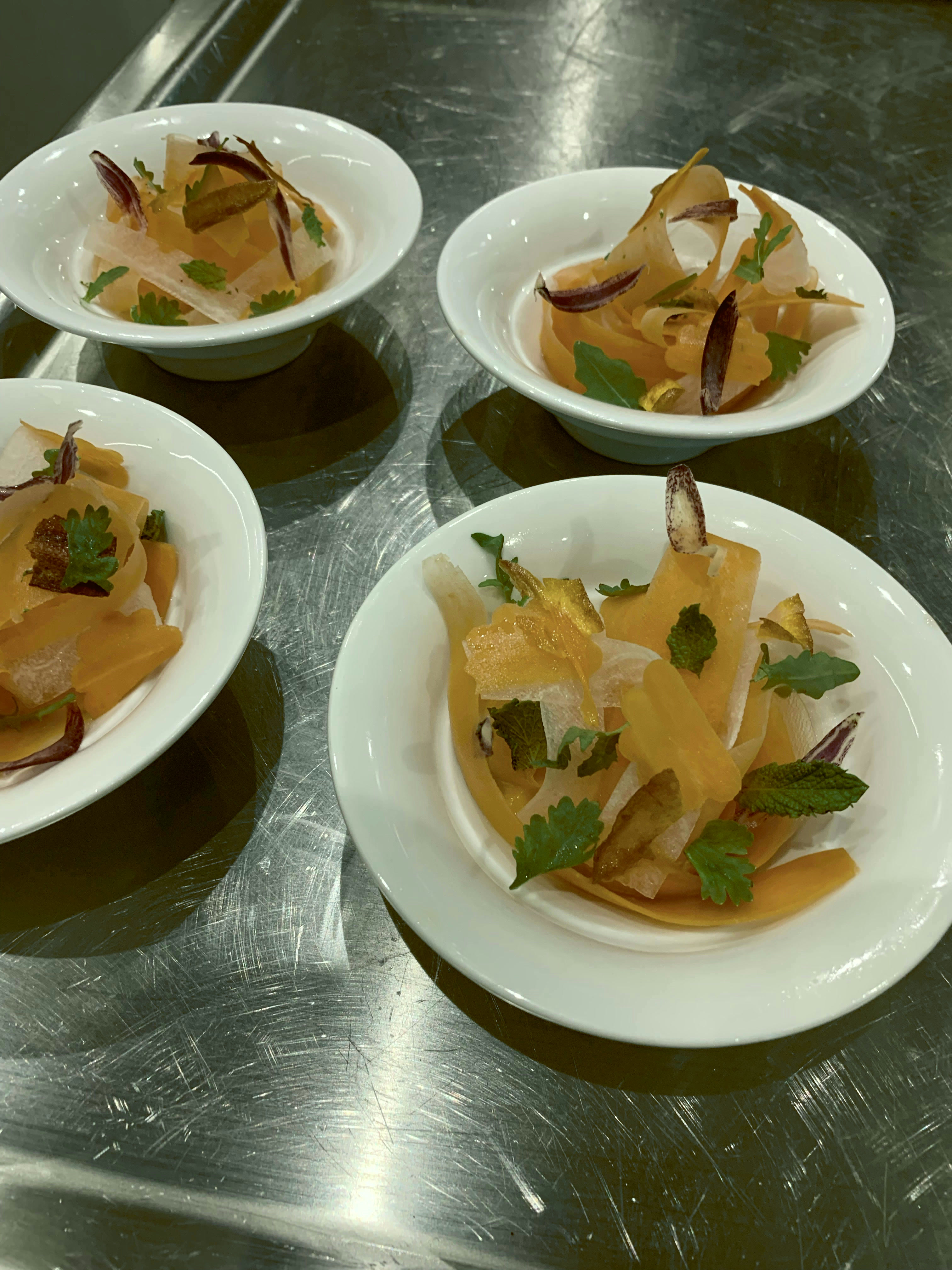 Persimmon and root salad, herbs